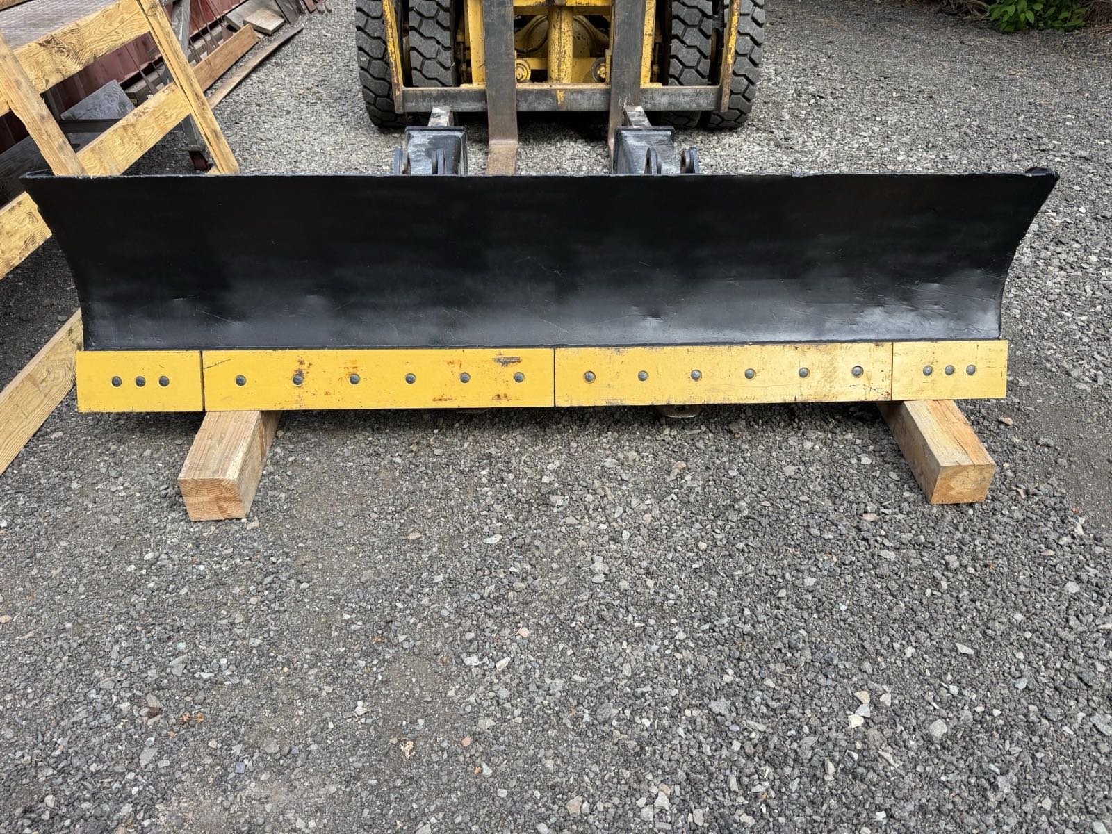 The same blade repaired and repainted with a fresh bolt-on cutting edge