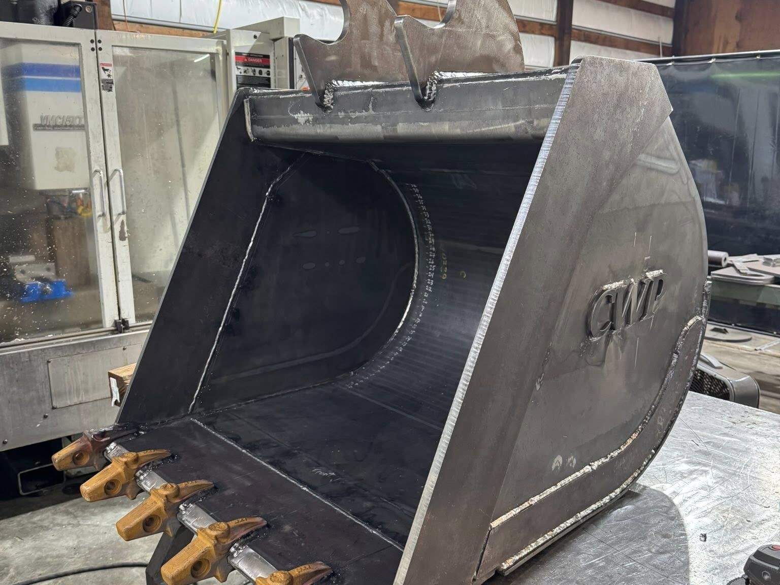 Dig bucket built from scratch, in bare steel fresh out of weld before paint