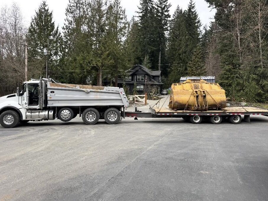 Hauling a customer's loader bucket in for rebuild on the CWP trailer
